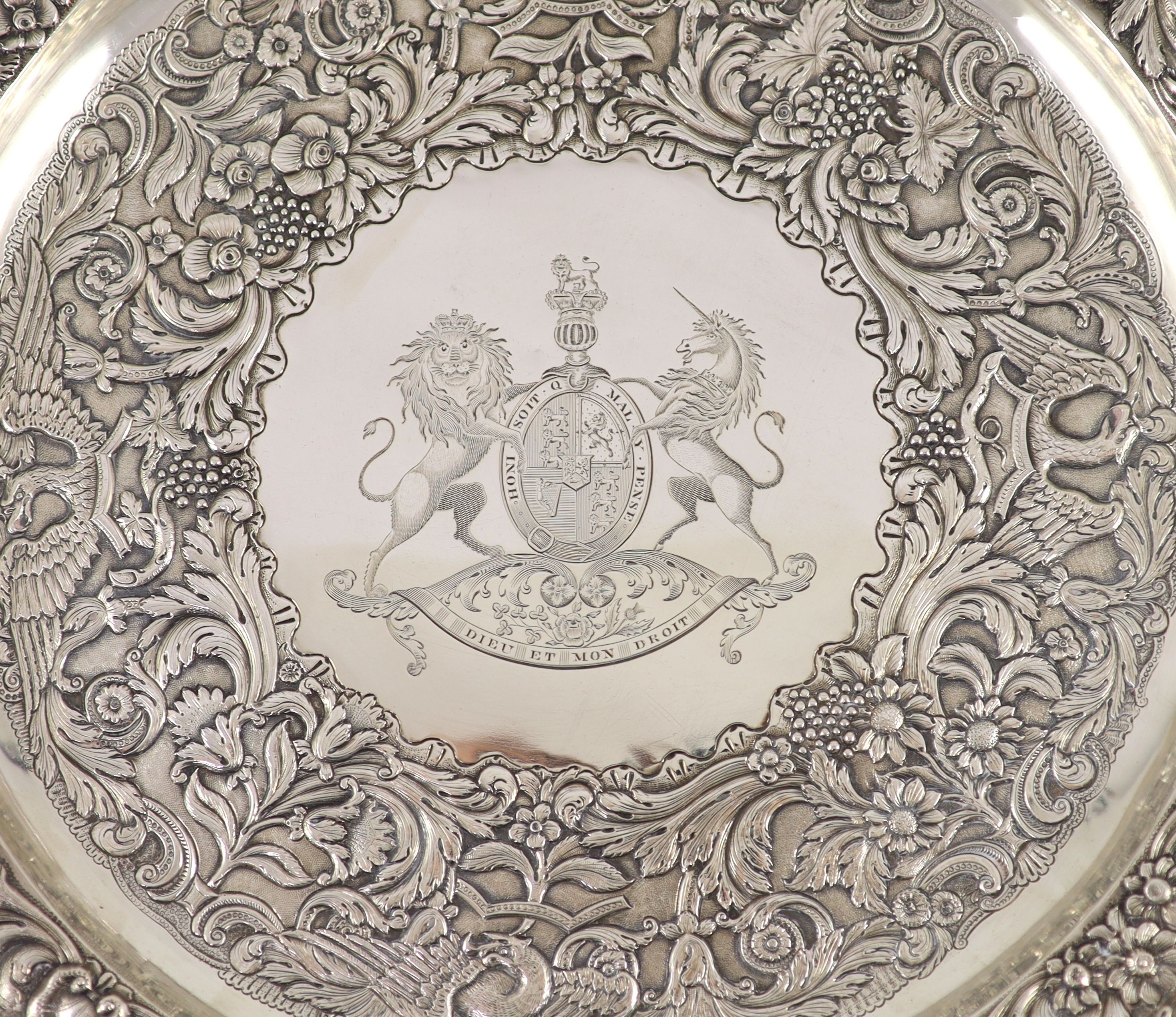 A George IV Irish embossed silver charger, by Stephen Bergin, engraved with the United Kingdom Royal Coat of Arms
